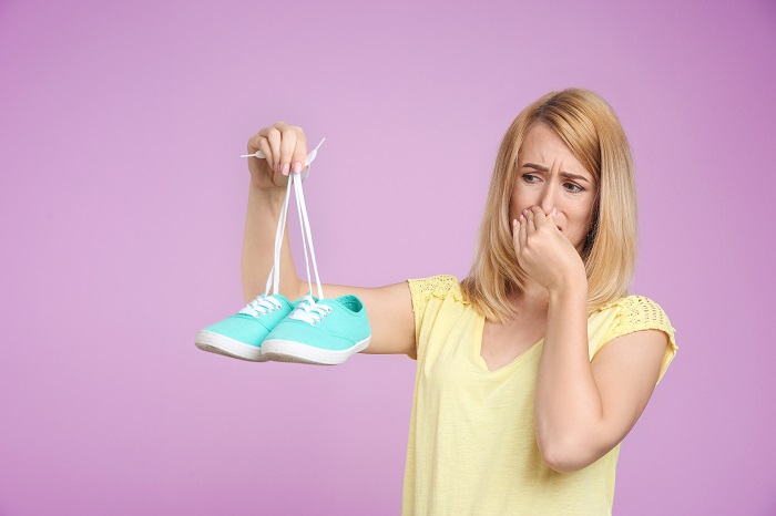 woman with smelly shoes